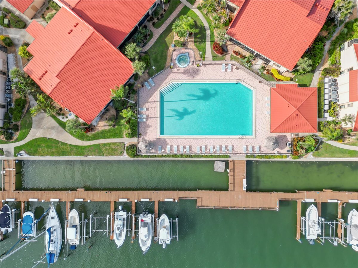 Aerial over the canal and boats toward Boca Ciega Bay, Point Brittany