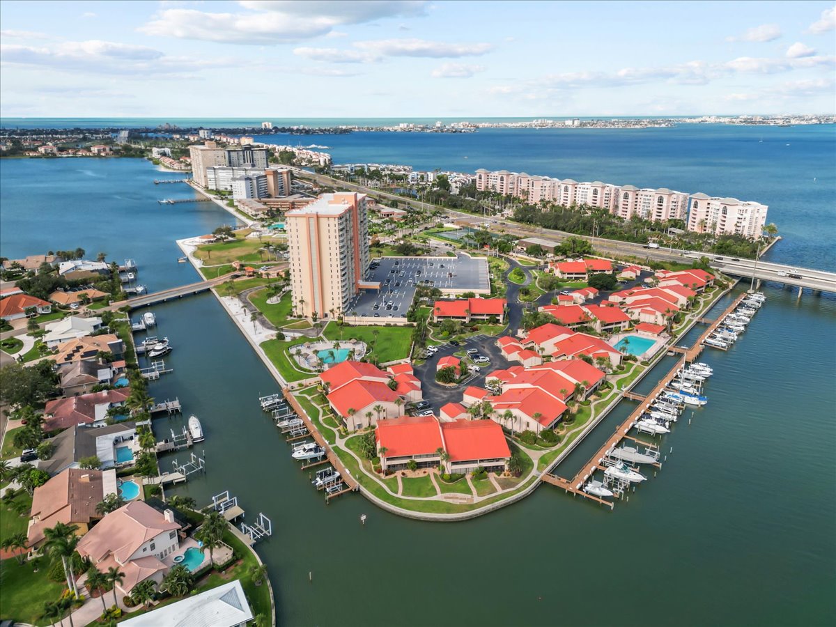 High aerial of Point Brittany peninsula, marina and Boca Ciega Bay toward the Gulf beaches