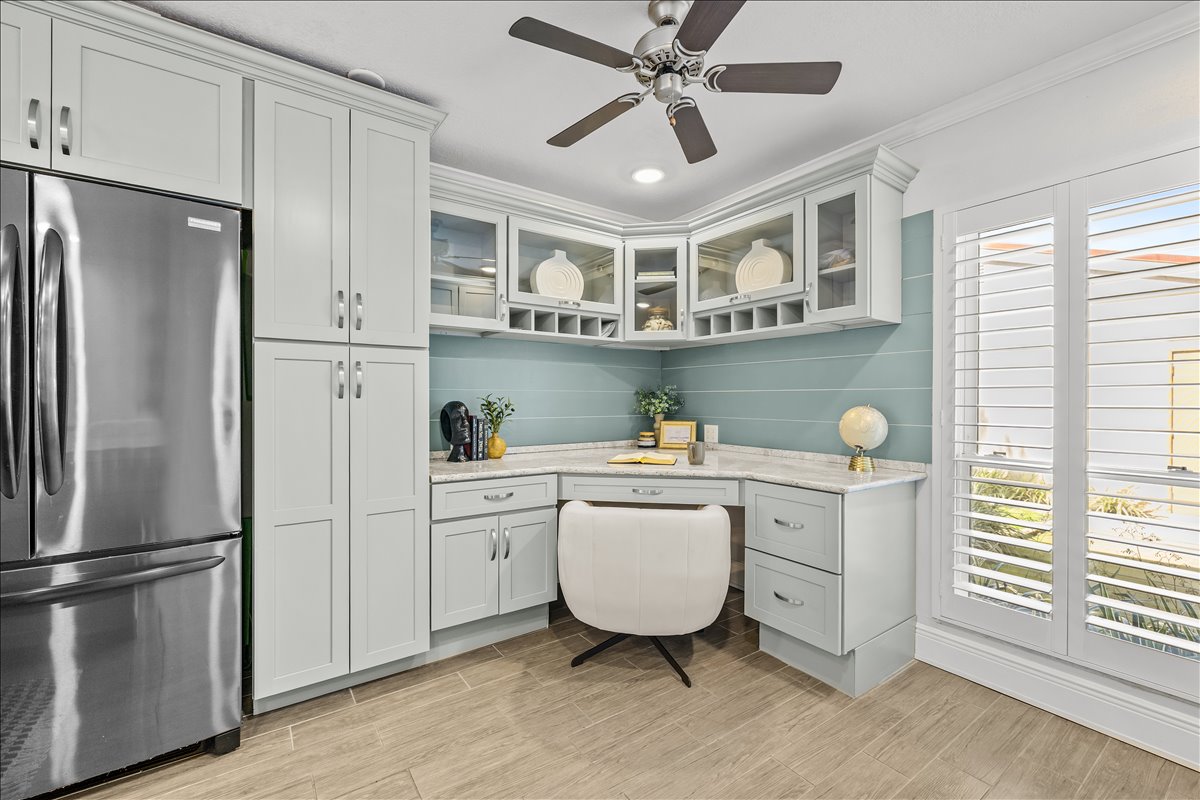 Built-in workspace nook with glass-inset cabinetry, 4730 Brittany Dr S #36