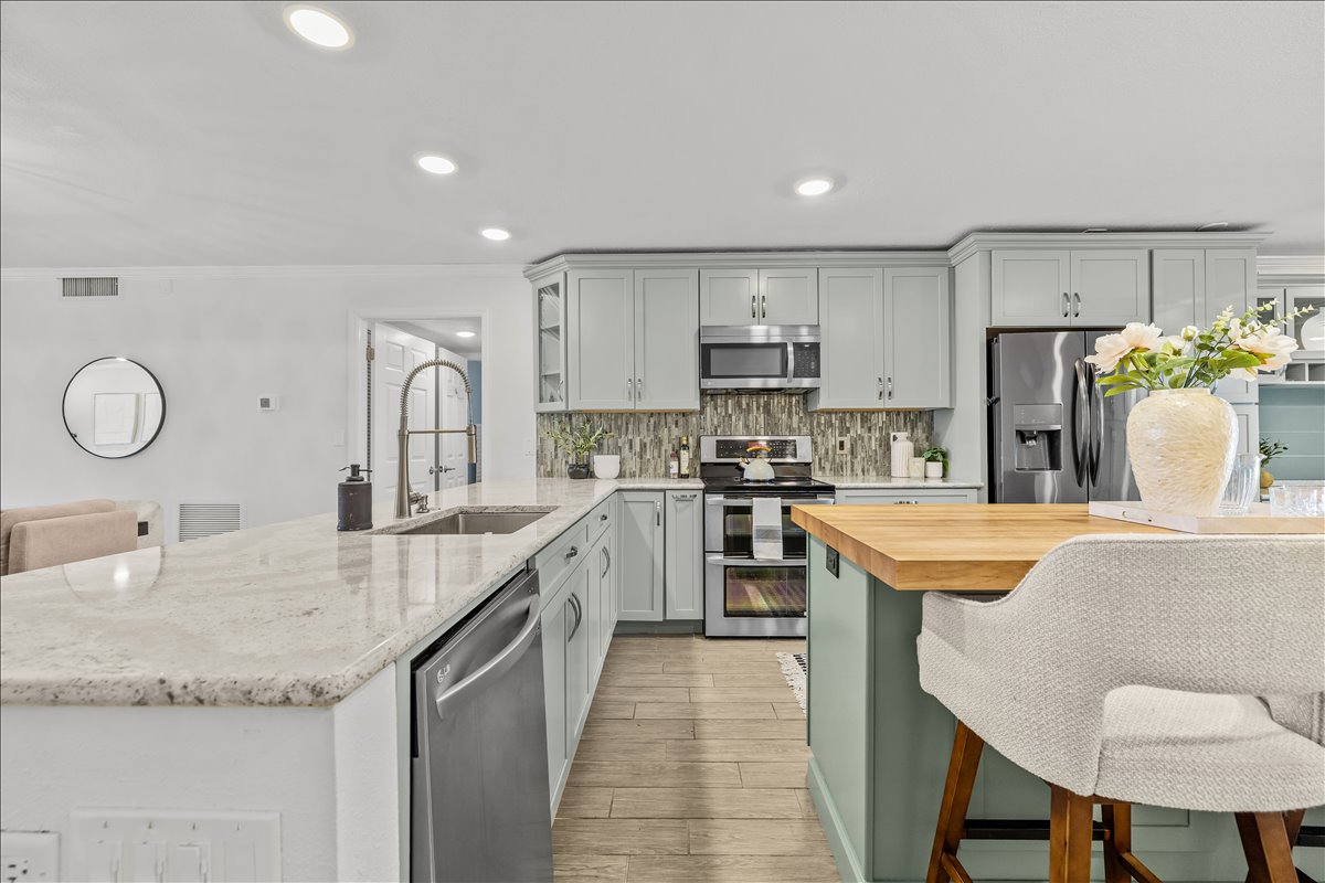 Kitchen with granite peninsula, sink and open sightlines, 4730 Brittany Dr S #36
