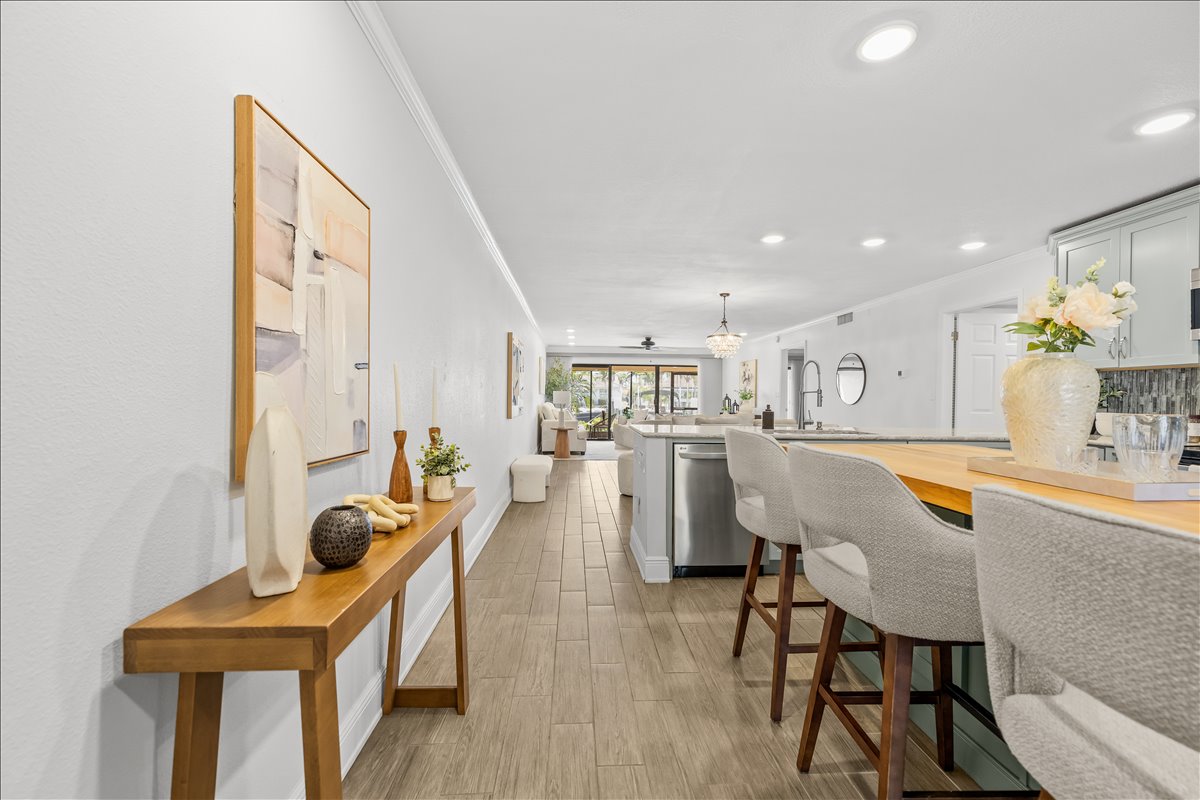 Entry hallway opening to the great room and kitchen island, 4730 Brittany Dr S #36