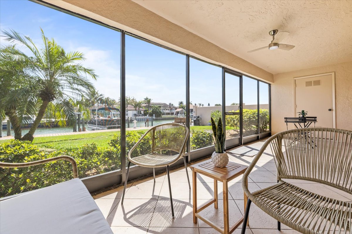 Screened waterfront lanai overlooking the canal and dock